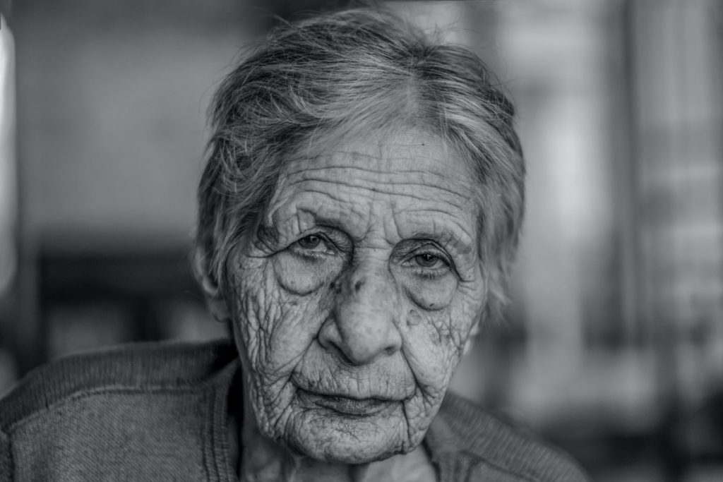 old woman in grey shirt
